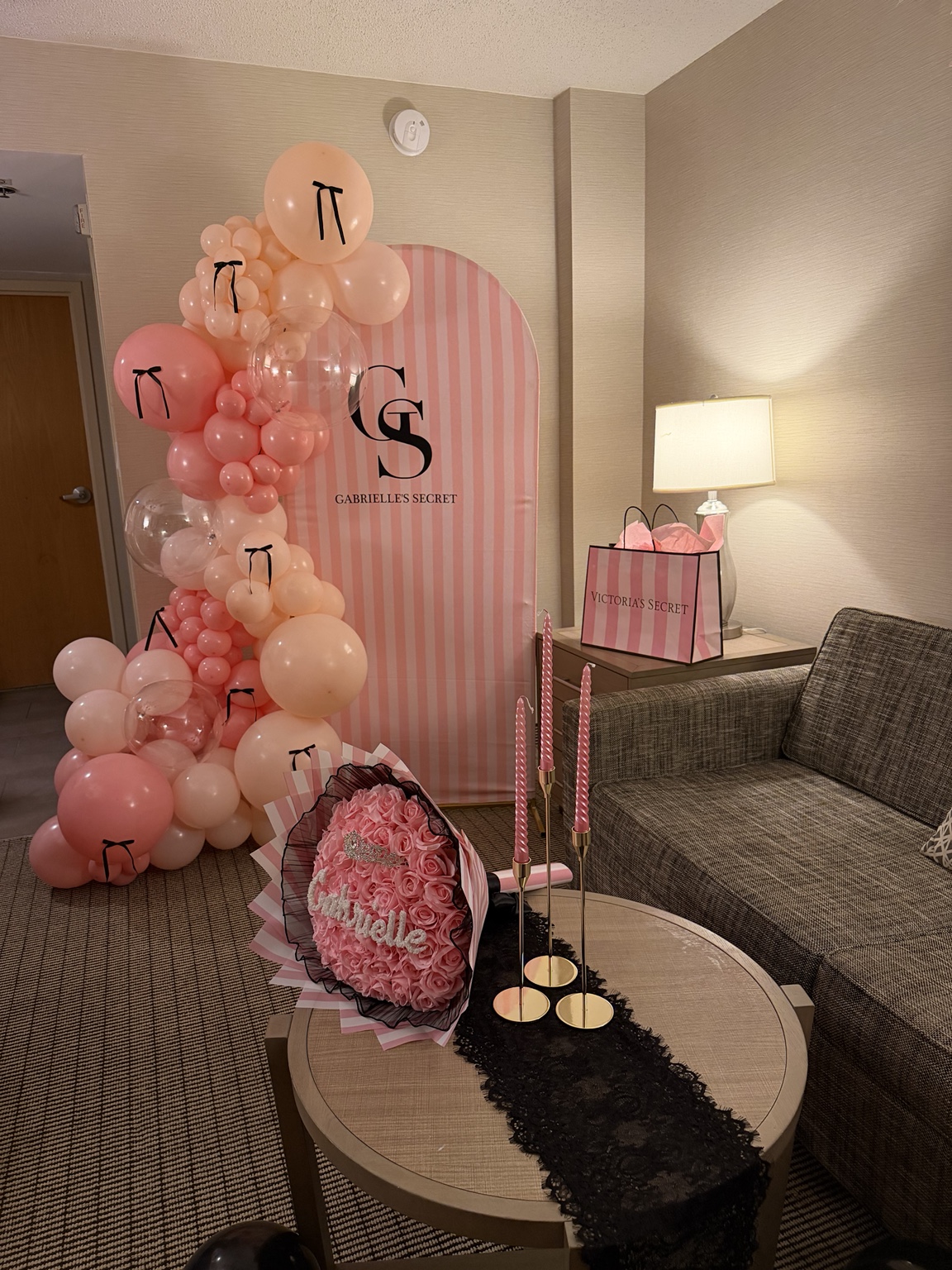 Pink Victoria’s Secret themed birthday balloon backdrop with teddy bears