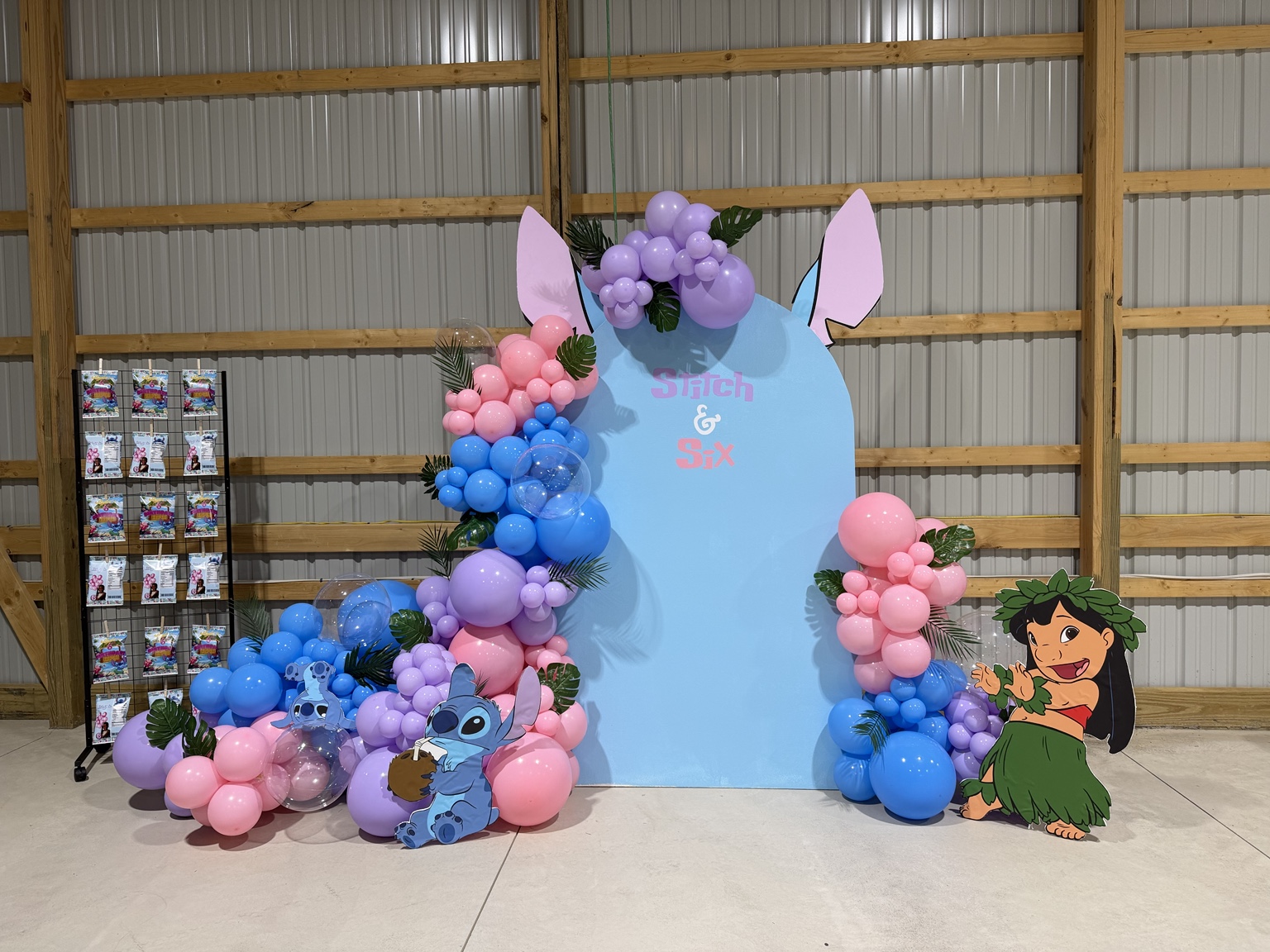 Blue, pink, and purple Stitch-themed balloon backdrop