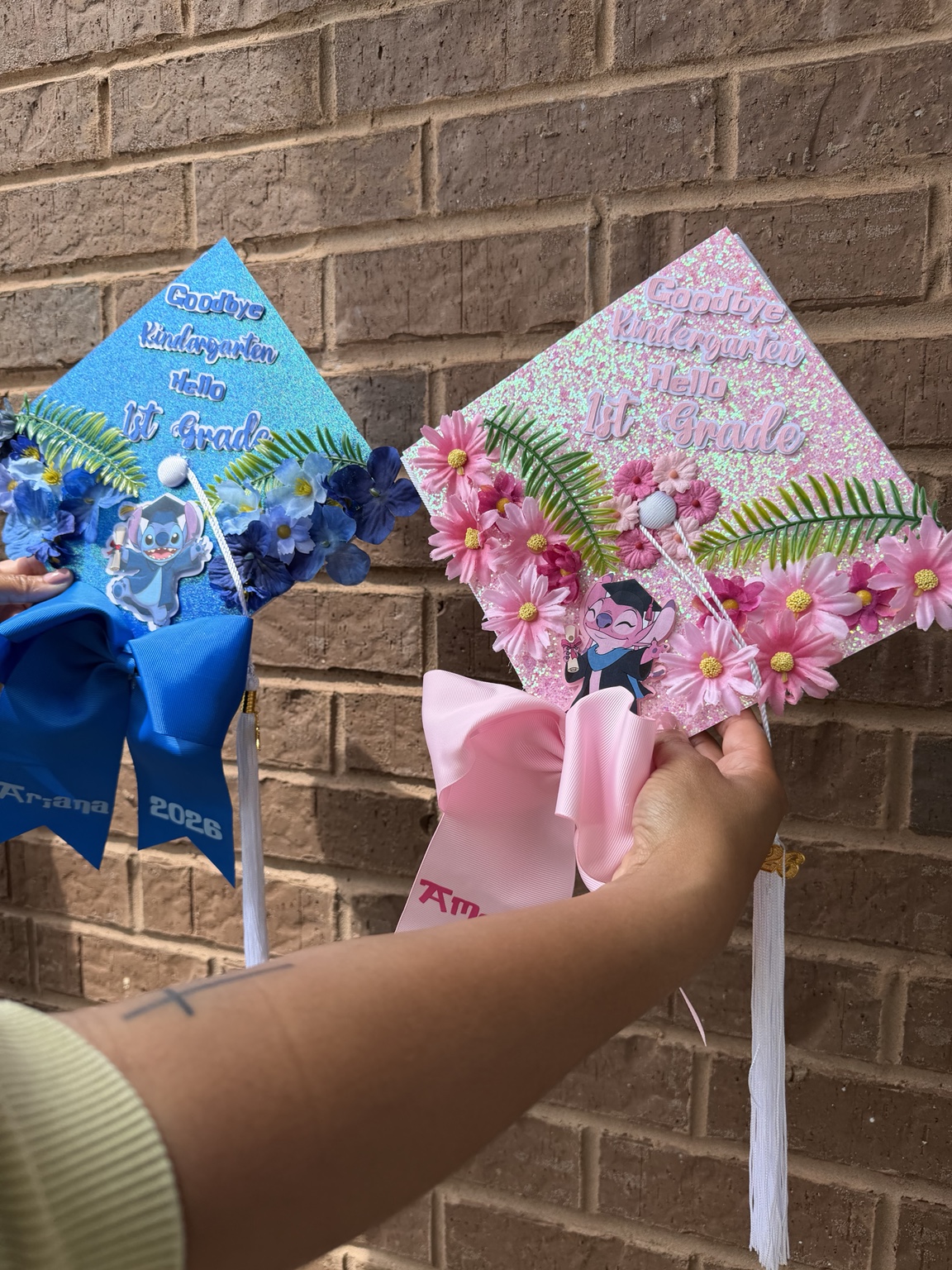 Two colorful custom graduation decorations with ribbons