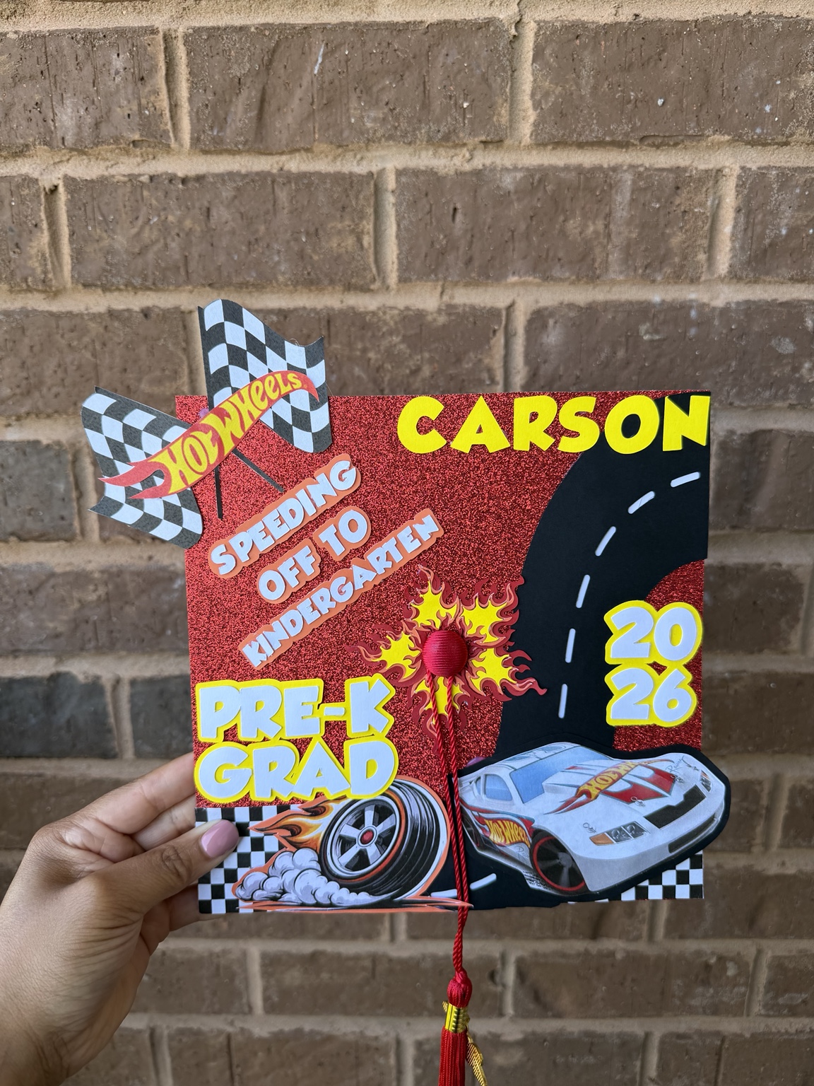 Custom racing themed graduation decoration with Carson name