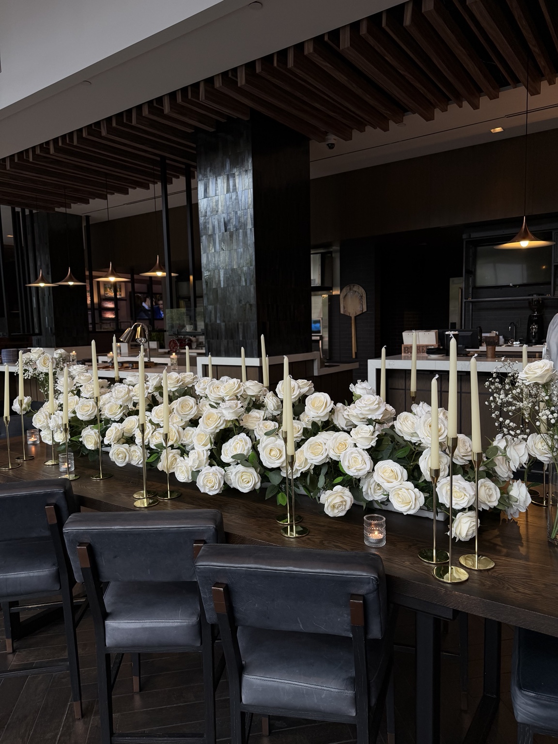 White rose floral display and taper candles
