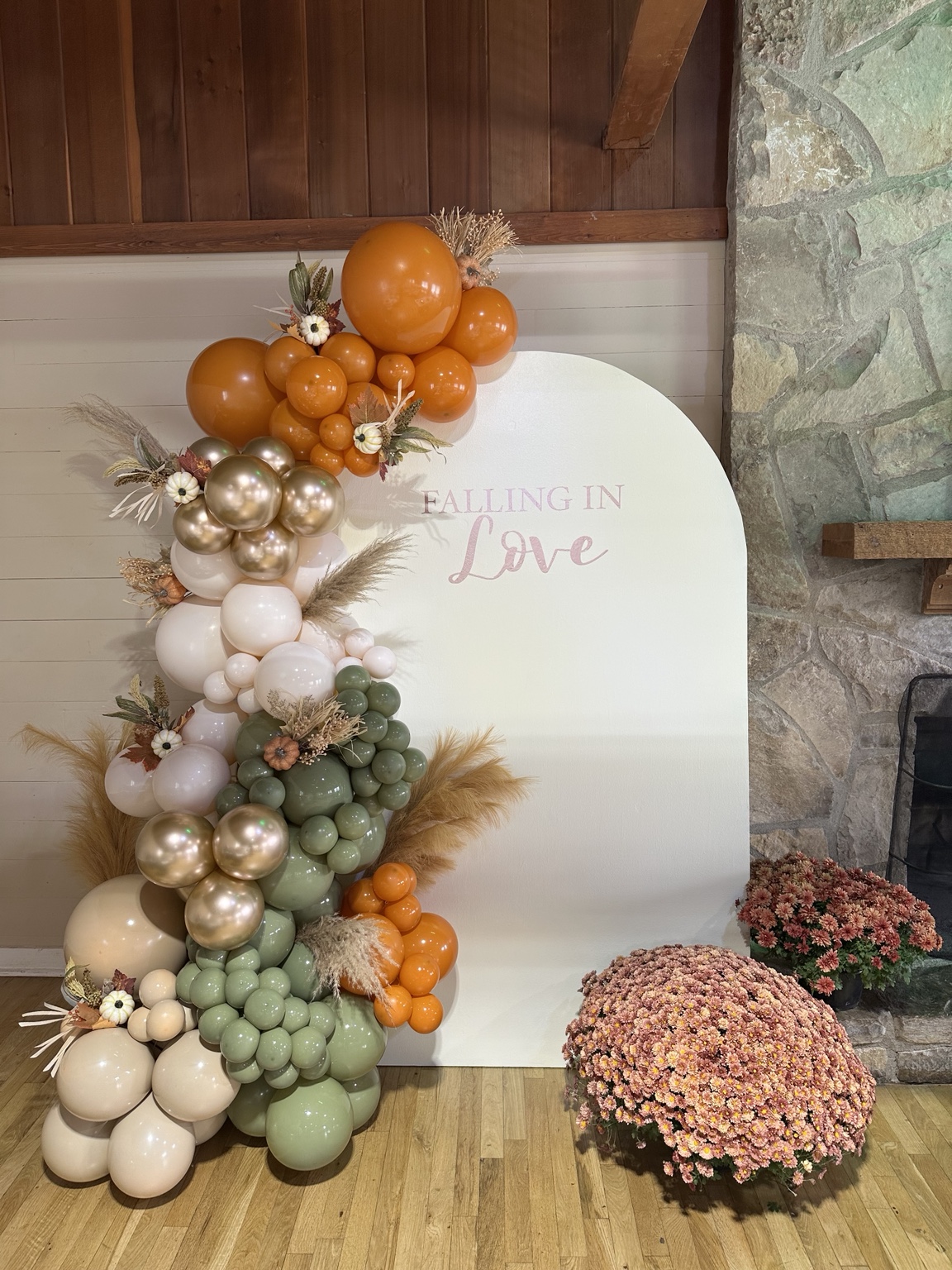 Autumn balloon backdrop with ivory, sage, gold, and orange details