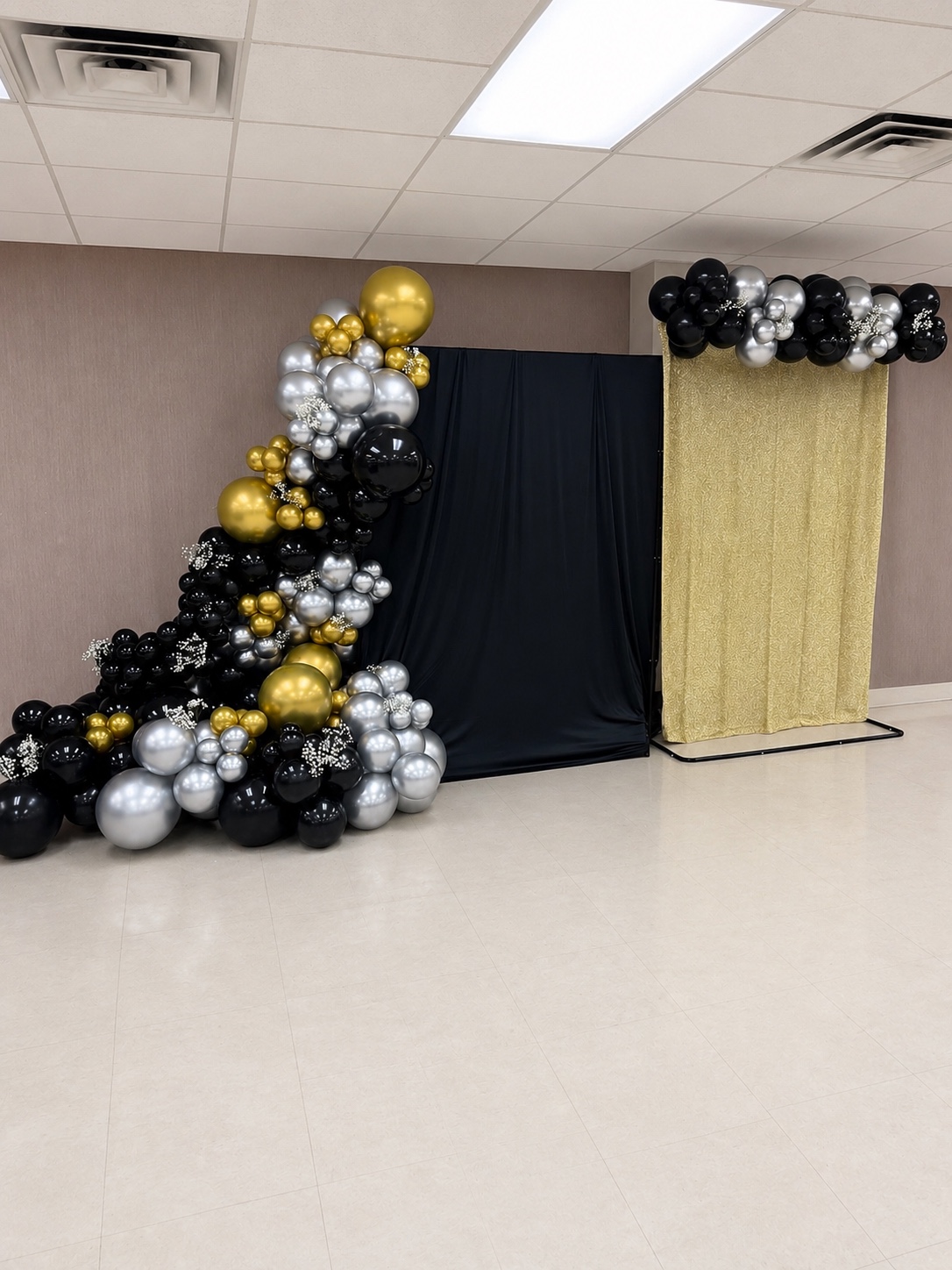 Black, silver, and gold balloon backdrop