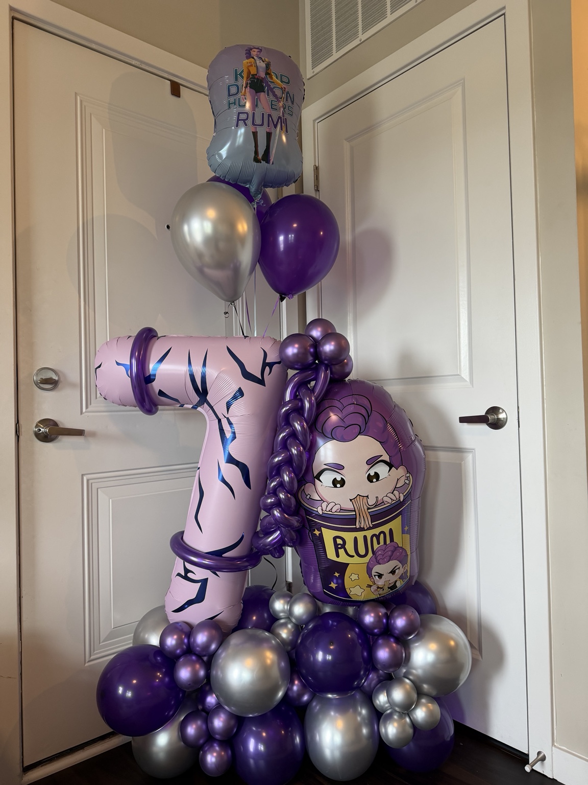 Purple and silver character-themed number seven balloon arrangement
